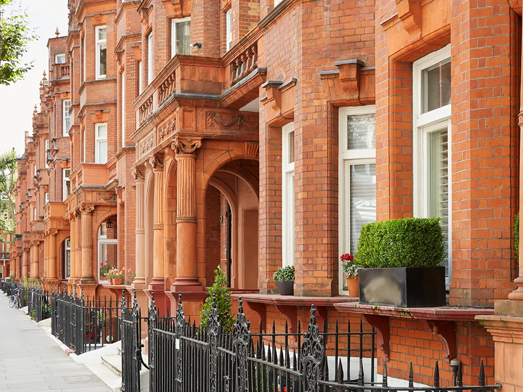 Red-brick mansion block with bay windows