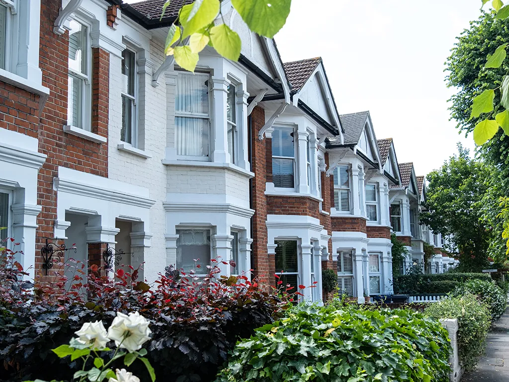 Bay-fronted houses behind front gardens
